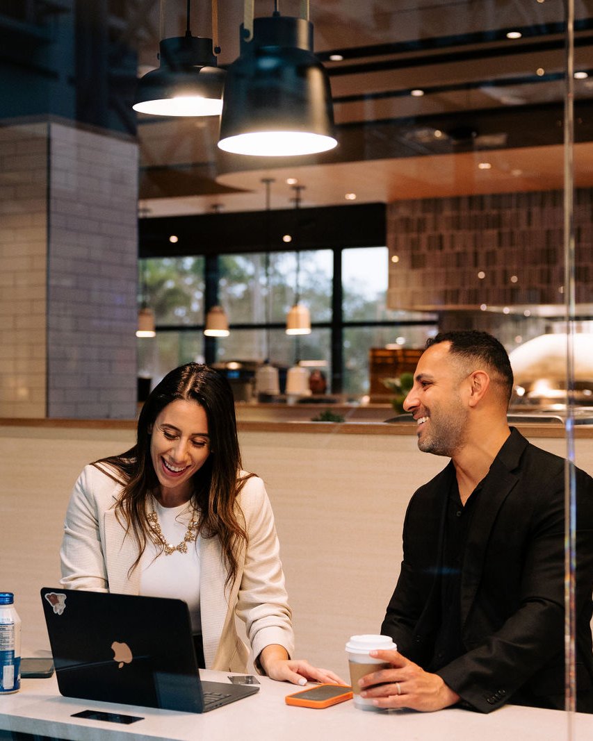 Charles Bello and a colleague from the EDM team working together on property