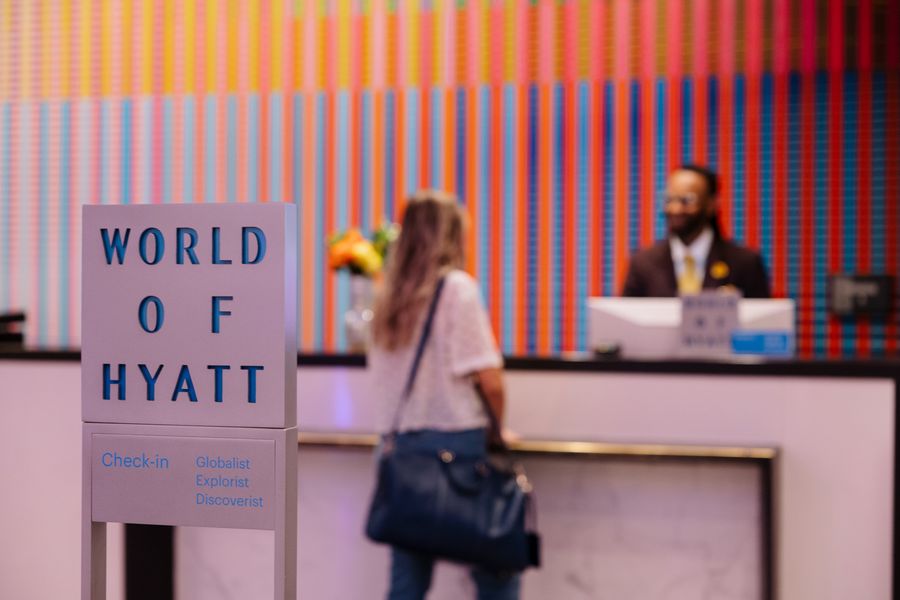 Guest checking in at the colorful front desk at Hyatt Regency Miami