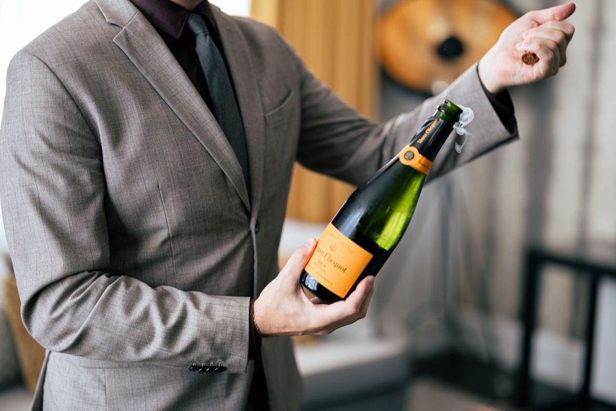 Sommelier presenting champagne at The US Grant